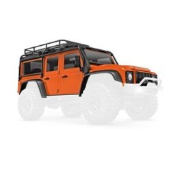 Body, Land Rover Defender, complete, orange (includes grille, side mirrors, door handles, fender flares, fuel canisters, jack, spare tire mount, & clipless mounting) [TRX9712-ORNG]